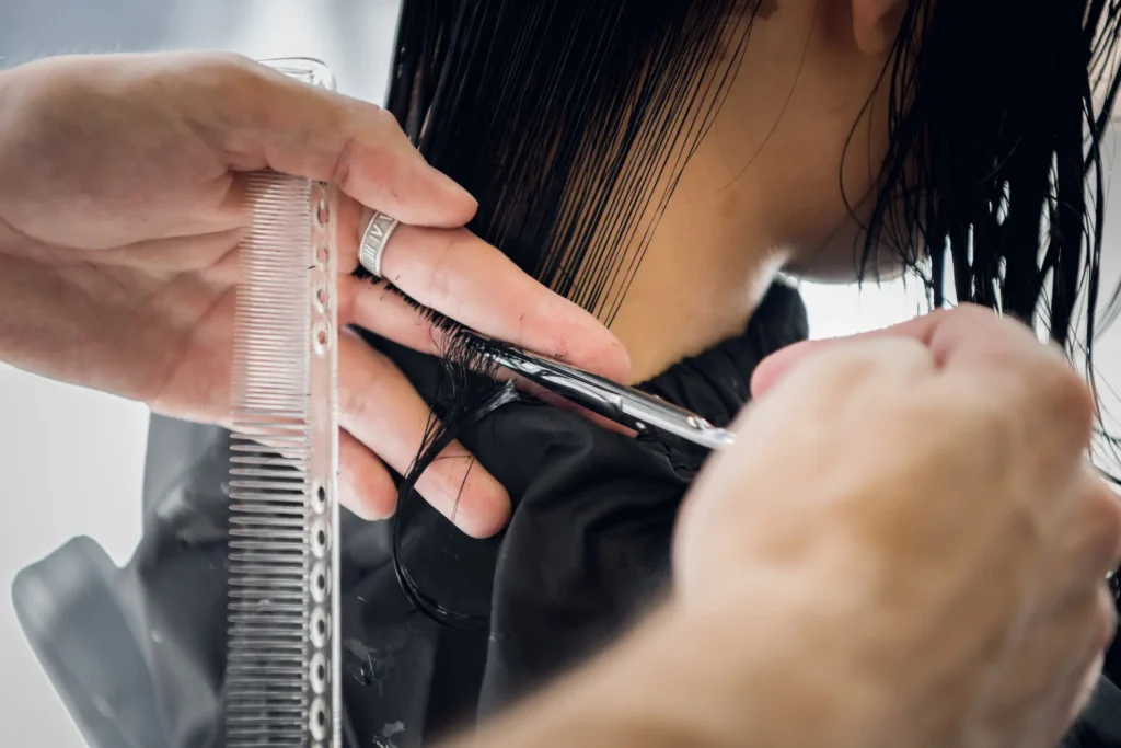 hairdresser cutting client s hair in salon with sc 2024 11 03 00 34 06 utc